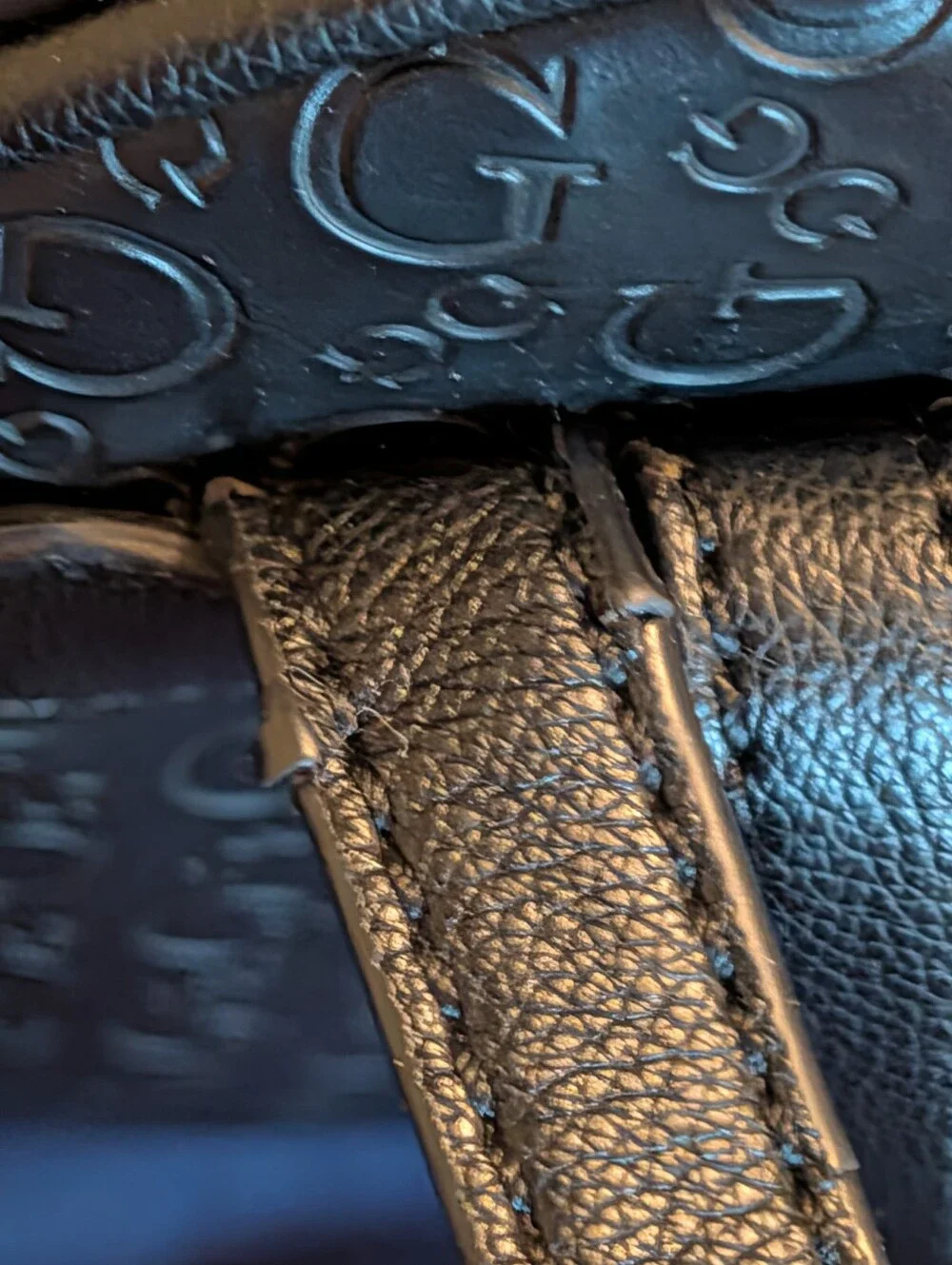 GUESS Black Embossed Logo Mini Backpack with Gold Accent